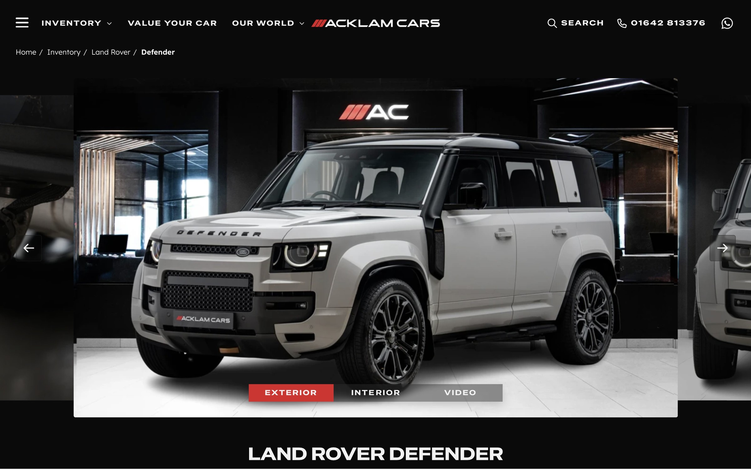 A Land Rover Defender vehicle page on desktop, with the studio photo gallery and exterior, interior and video tabs